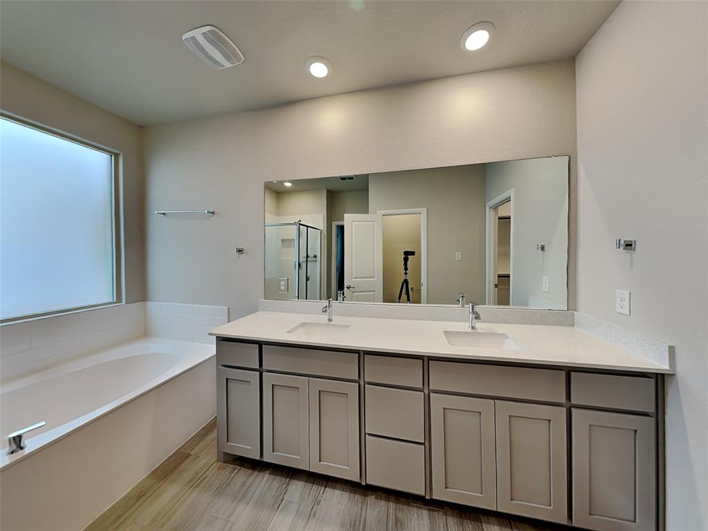 2344 Jack Rabbit Way Northlake, TX 76247 - Photo 8 of 17 a bathroom with a double vanity sink and a mirror