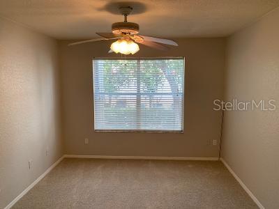824 Camargo Way, Unit 206 Altamonte Springs, FL 32714 - Photo 6 of 10 an empty room with chandelier fan and windows