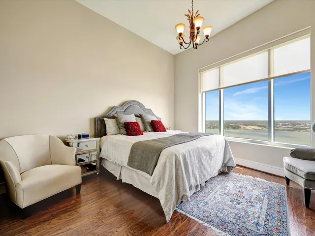 a bedroom with a large bed and a couch