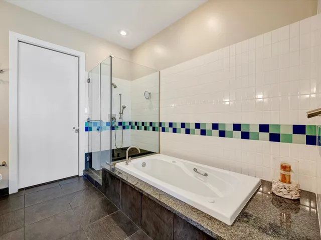 a bathroom with a tub and a sink