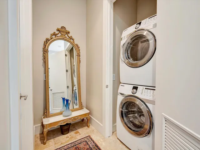 a view of a bedroom with washer and dryer