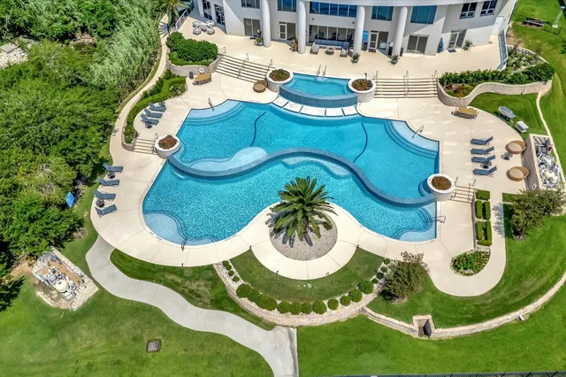 a view of a swimming pool with lounge chair