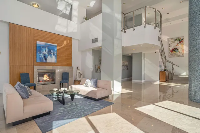 a living room with furniture and fireplace