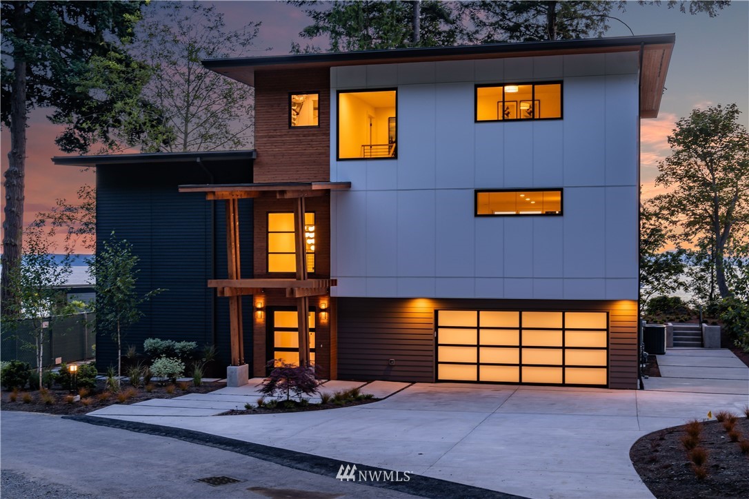5616 Beach Drive Southwest Seattle, WA 98136 - Photo 2 of 40 a front view of a house with garage