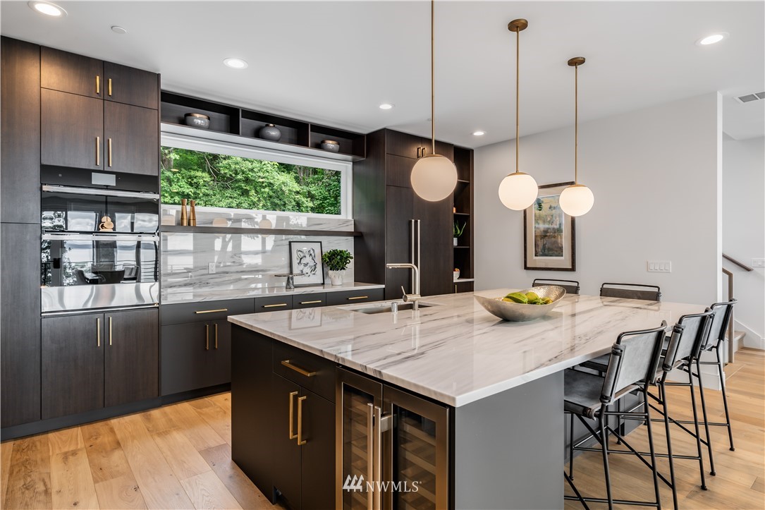 5616 Beach Drive Southwest Seattle, WA 98136 - Photo 11 of 40 a kitchen with a table and chairs in it