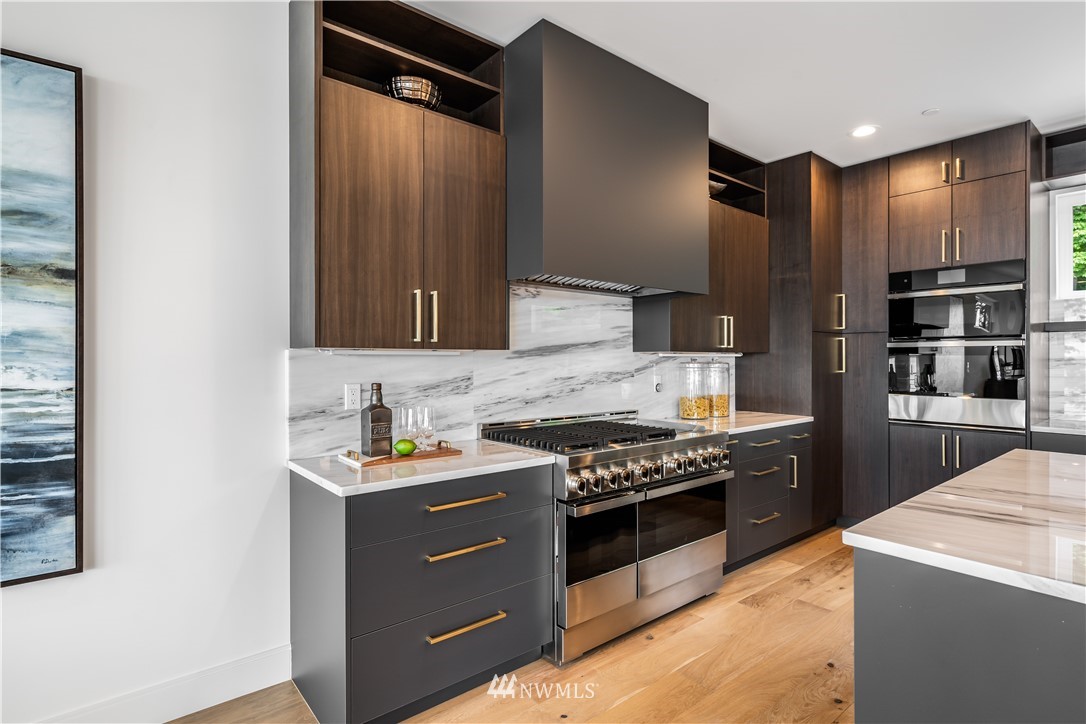 5616 Beach Drive Southwest Seattle, WA 98136 - Photo 13 of 40 a kitchen with stainless steel appliances a stove and a refrigerator
