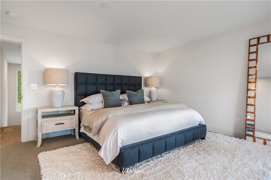 5616 Beach Drive Southwest Seattle, WA 98136 - Photo 16 of 40 a bedroom with a bed and a window