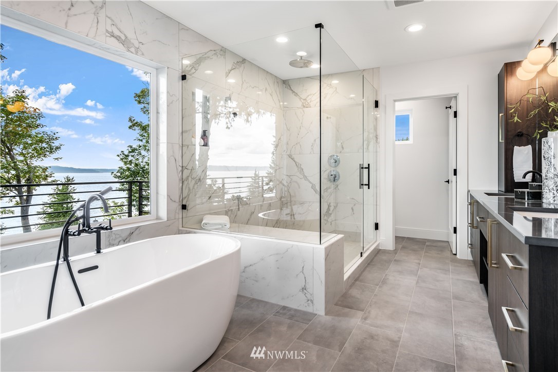 5616 Beach Drive Southwest Seattle, WA 98136 - Photo 17 of 40 a large spacious bathroom with a large tub shower and sink