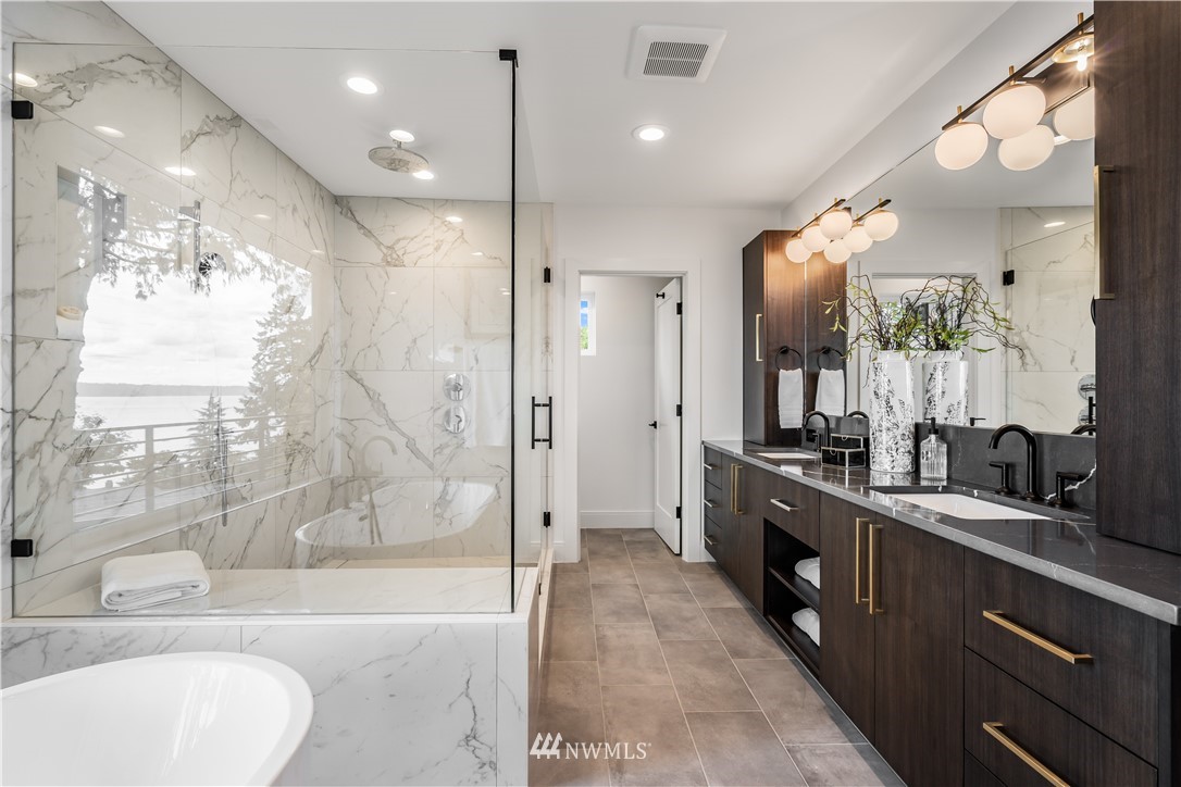 5616 Beach Drive Southwest Seattle, WA 98136 - Photo 19 of 40 a bathroom with a large tub sink shower and mirror