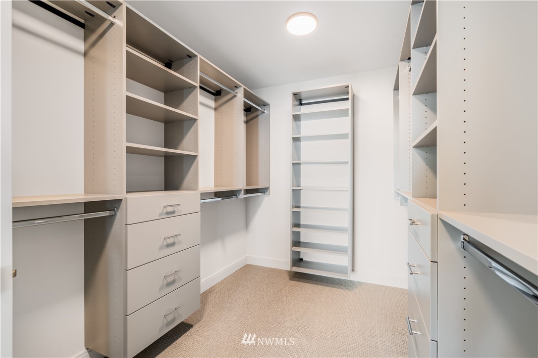 5616 Beach Drive Southwest Seattle, WA 98136 - Photo 20 of 40 a view of walk in closet with empty racks