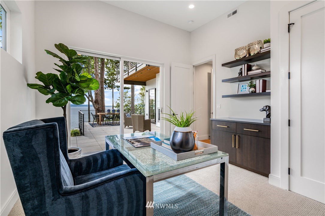 5616 Beach Drive Southwest Seattle, WA 98136 - Photo 23 of 40 a living room with furniture potted plant and a window
