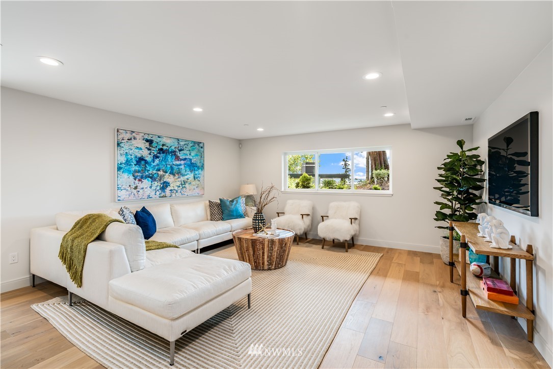 5616 Beach Drive Southwest Seattle, WA 98136 - Photo 26 of 40 a living room with furniture and a flat screen tv