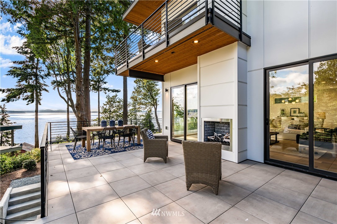 5616 Beach Drive Southwest Seattle, WA 98136 - Photo 30 of 40 a view of a patio with dining table and chairs