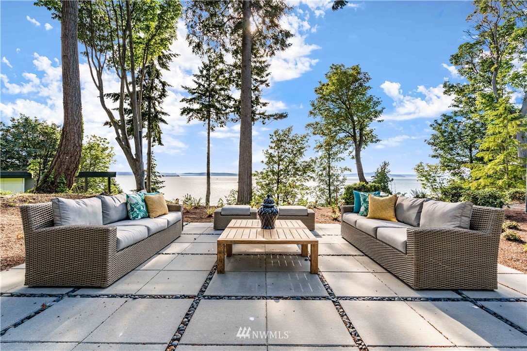 5616 Beach Drive Southwest Seattle, WA 98136 - Photo 35 of 40 a view of a patio with couches and a potted plant on a table