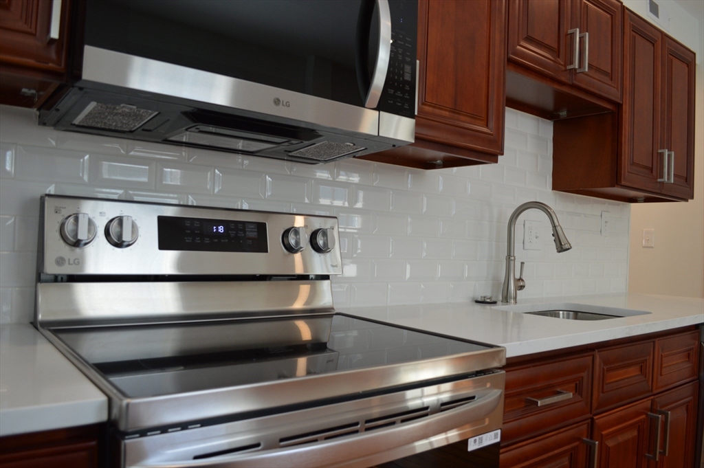 a close view of stove and microwave