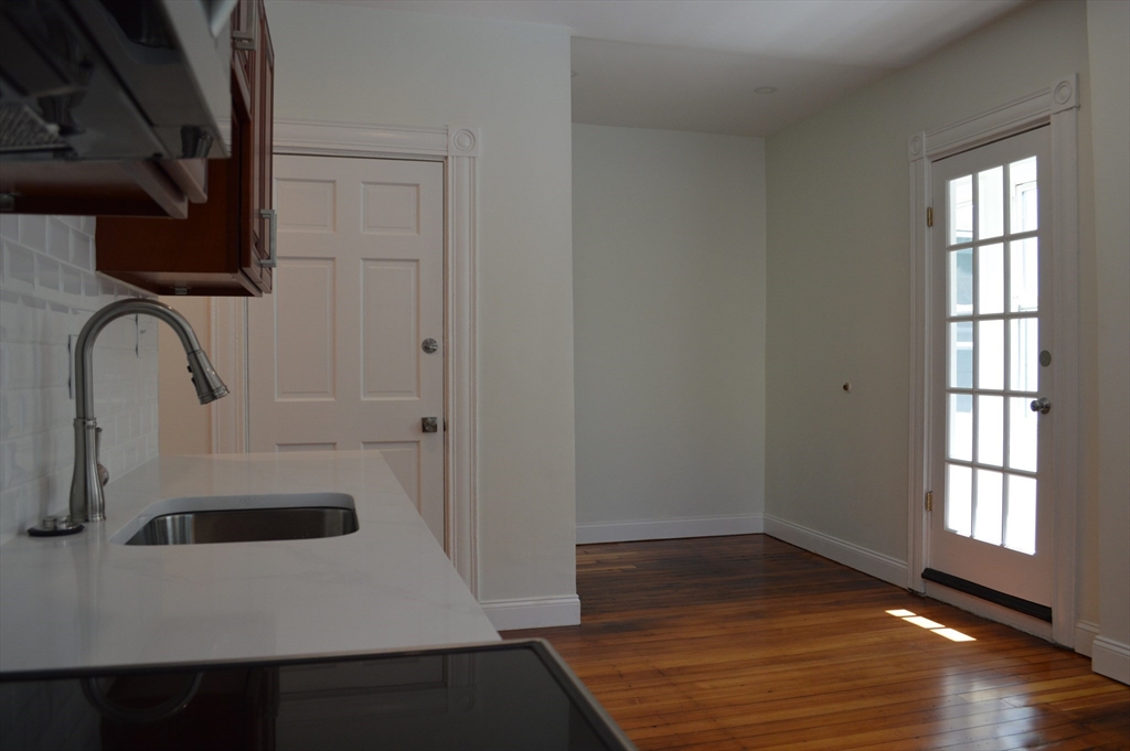 374 B Centre Street, Unit 2 Boston, MA 02130 - Photo 4 of 11 a bathroom with a sink and a window