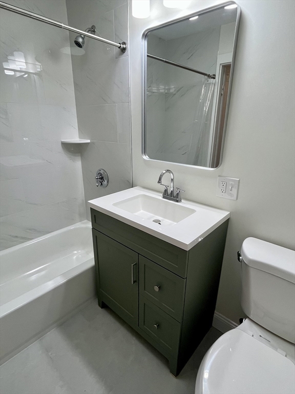 374 B Centre Street, Unit 2 Boston, MA 02130 - Photo 6 of 11 a bathroom with a sink toilet and shower
