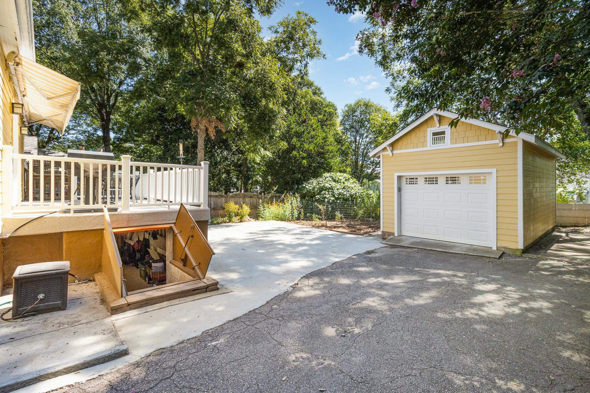 301 Duncan Street Raleigh, NC 27608 - Photo 30 of 41 Doors open to workshop below with electricity. Side Yard