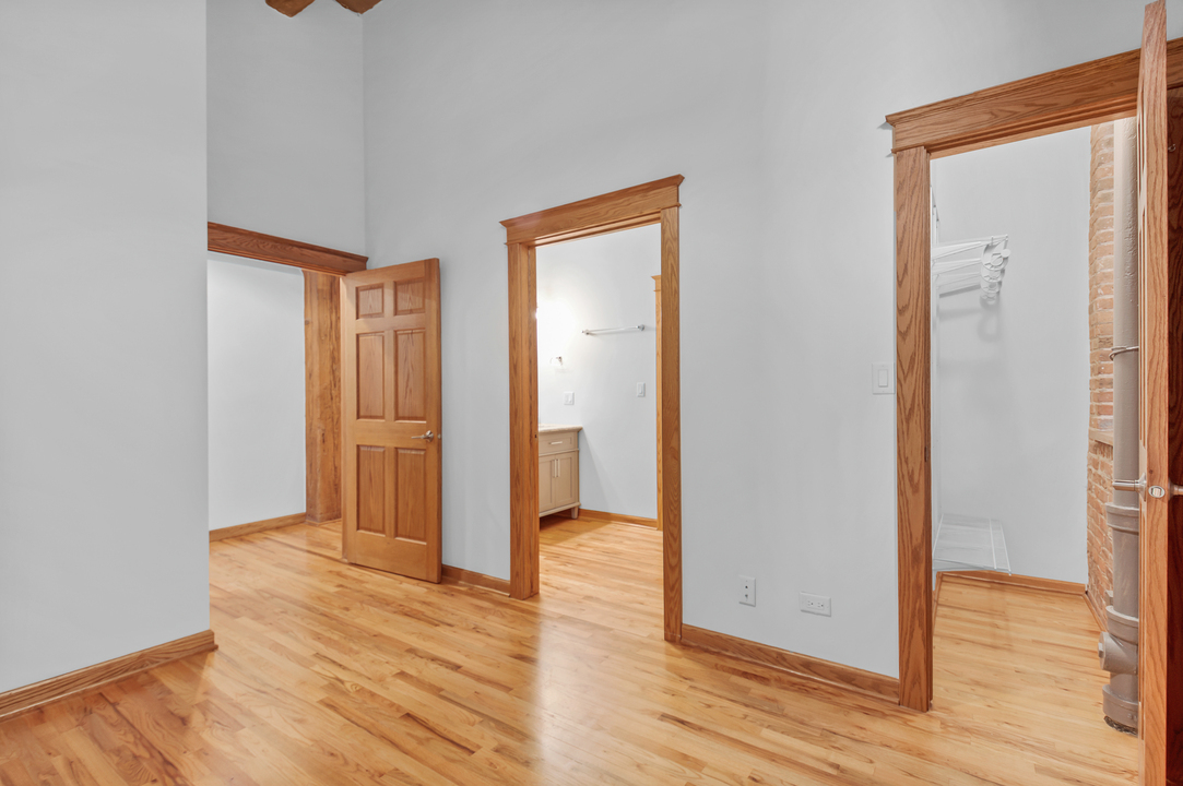 216 North May Street, Unit 103 Chicago, IL 60607 - Photo 10 of 21 a view of entryway with wooden floor