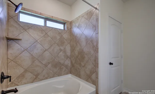 a bathroom with a bathtub