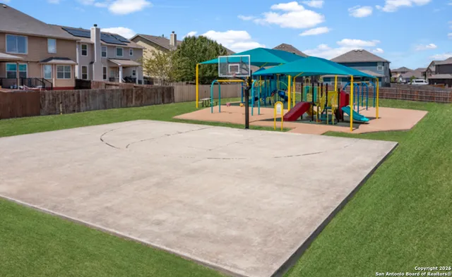 an outdoor space with furniture and umbrella