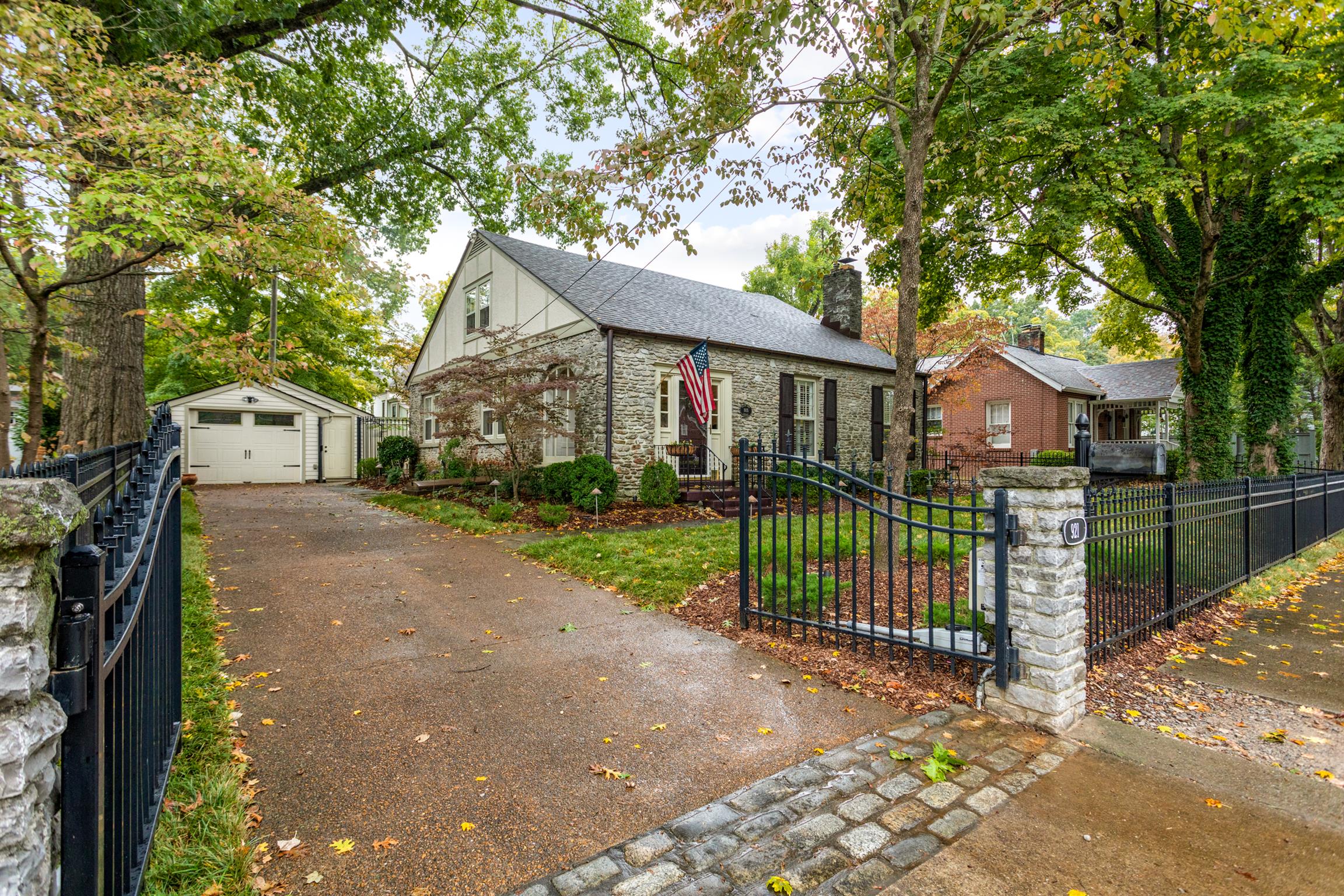 921 Fair Street Franklin, TN 37064 - Photo 1 of 30 a front view of a house with a garden and tree