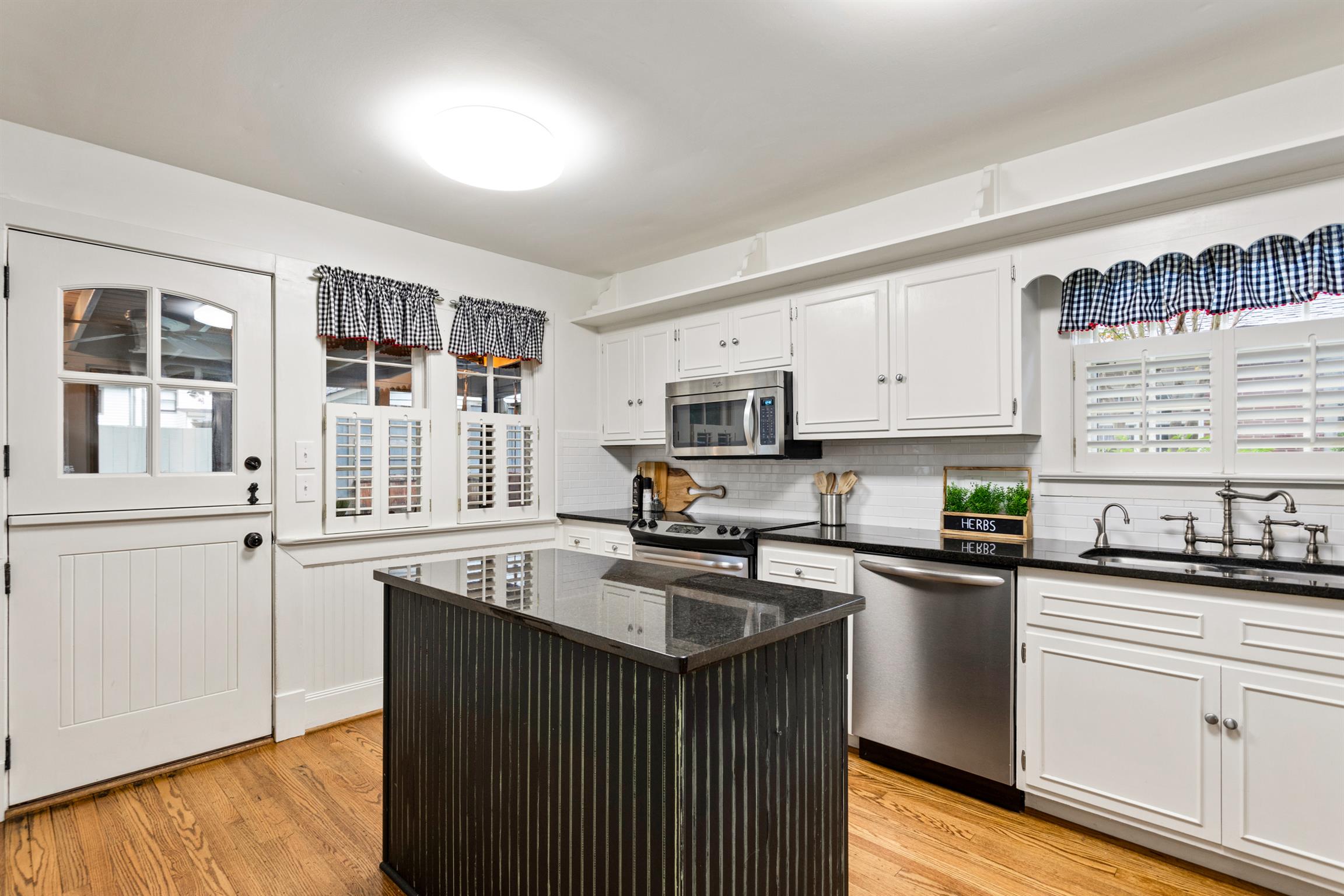 921 Fair Street Franklin, TN 37064 - Photo 11 of 30 a kitchen with stainless steel appliances granite countertop a sink stove and cabinets