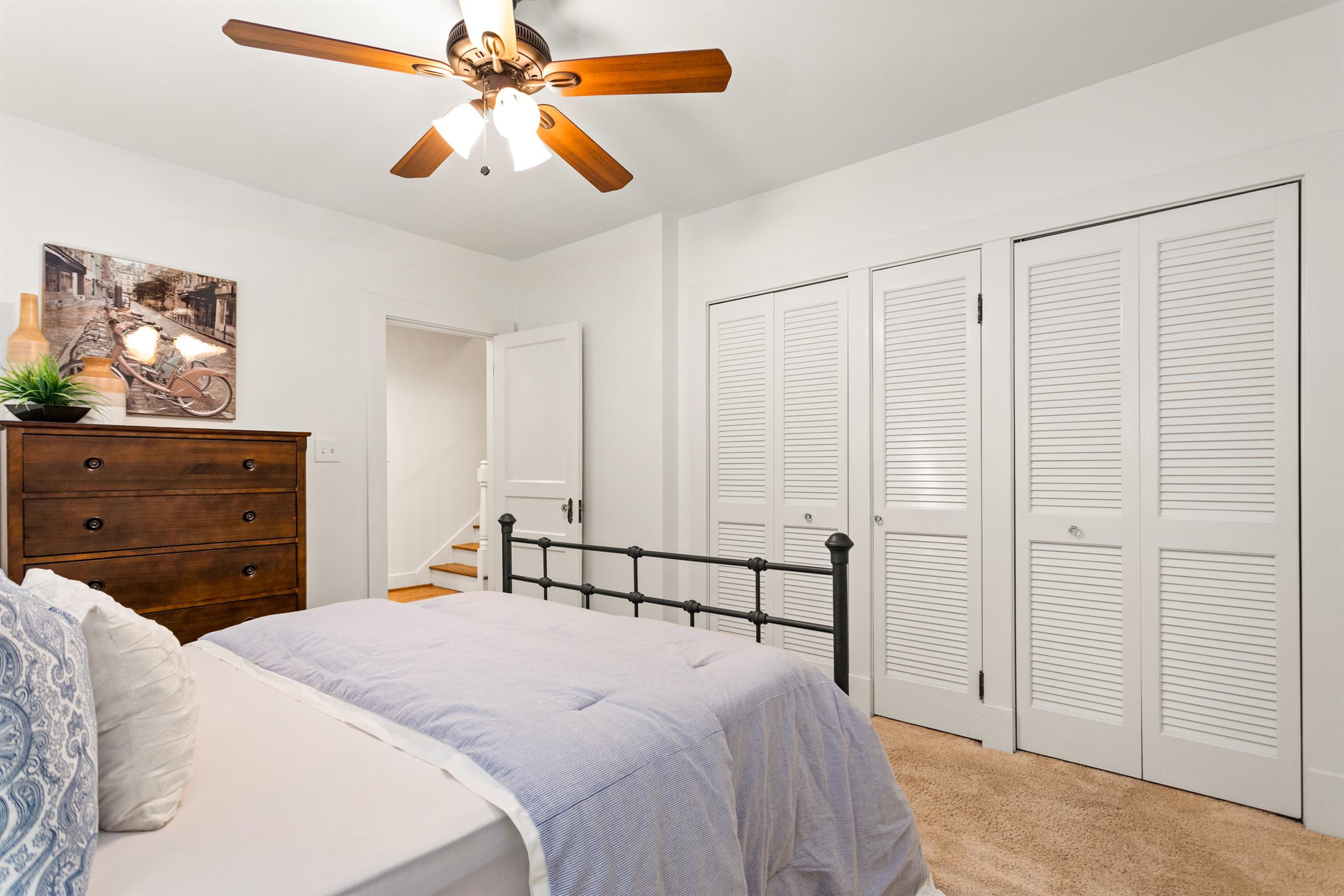 921 Fair Street Franklin, TN 37064 - Photo 20 of 30 a bedroom with a bed and a chandelier