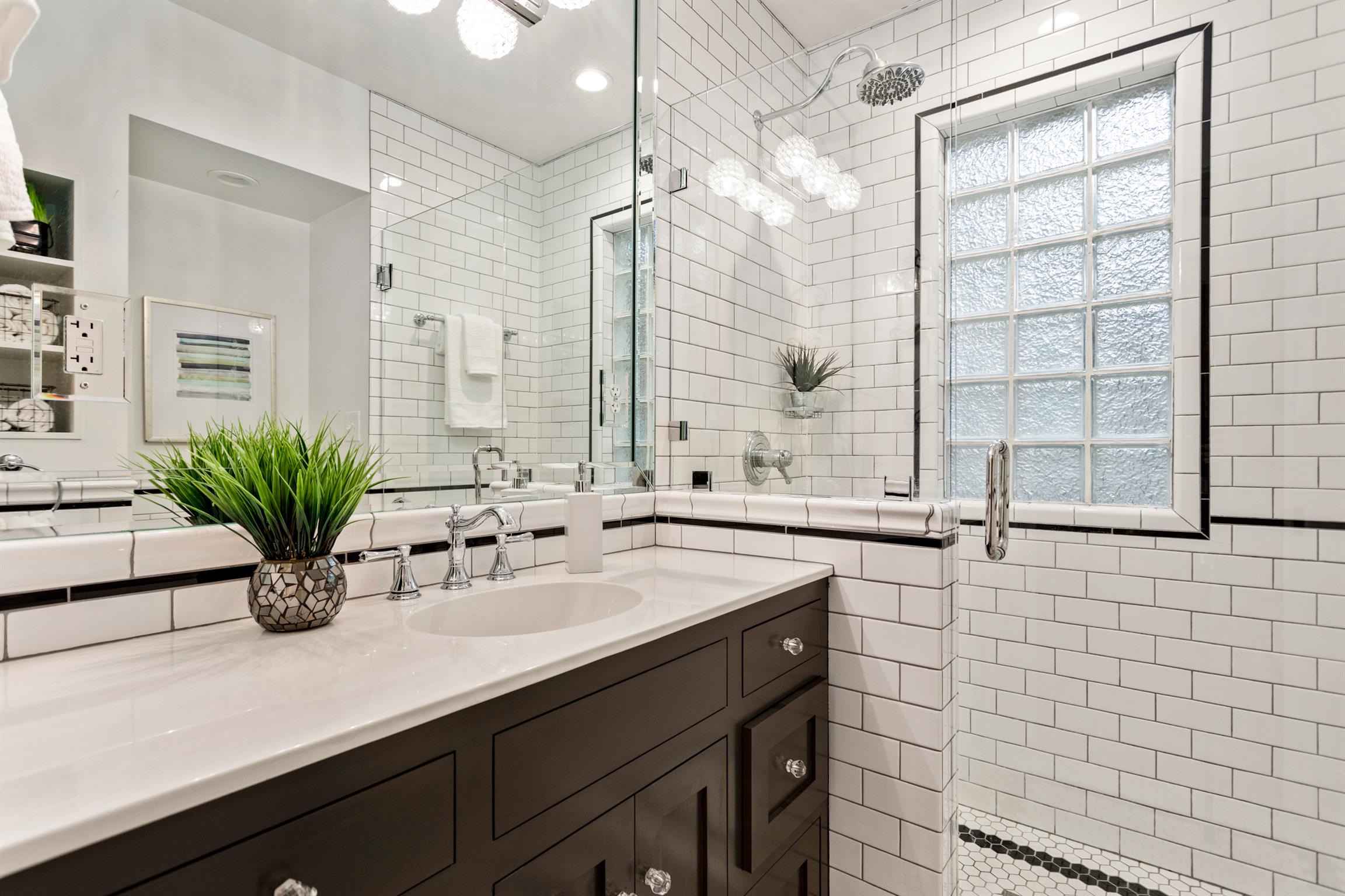 921 Fair Street Franklin, TN 37064 - Photo 21 of 30 a bathroom with a sink a mirror and a shower