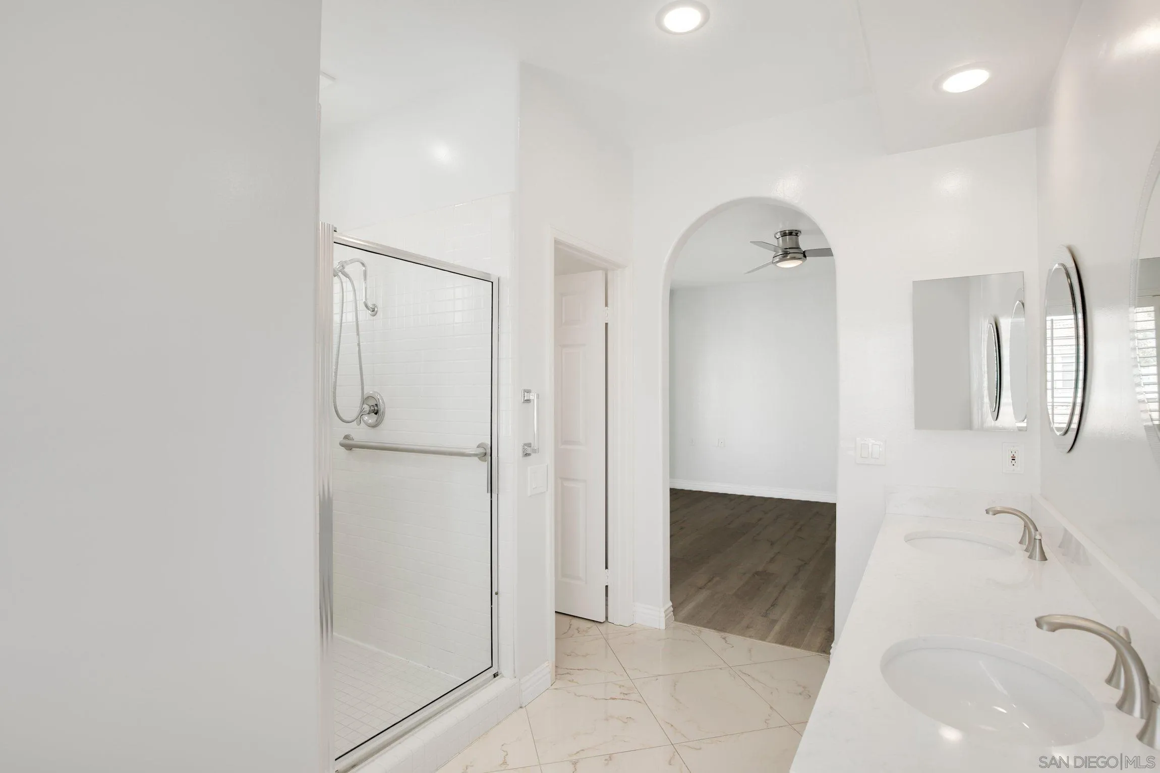 3355 Genoa Way, Unit 134 Oceanside, CA 92056 - Photo 23 of 32 a bathroom with a bathtub and a shower