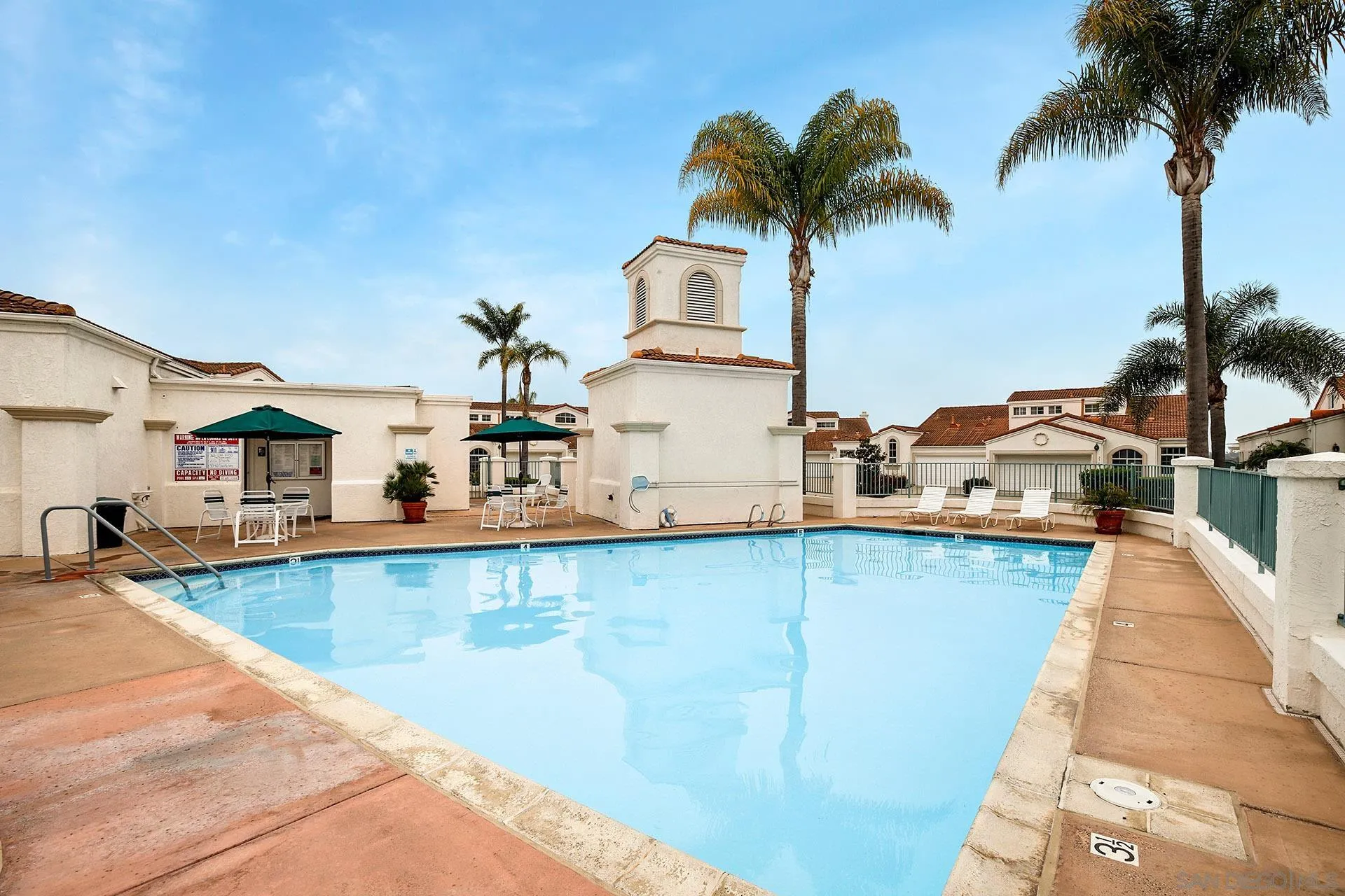 3355 Genoa Way, Unit 134 Oceanside, CA 92056 - Photo 31 of 32 a view of a swimming pool and a terrace