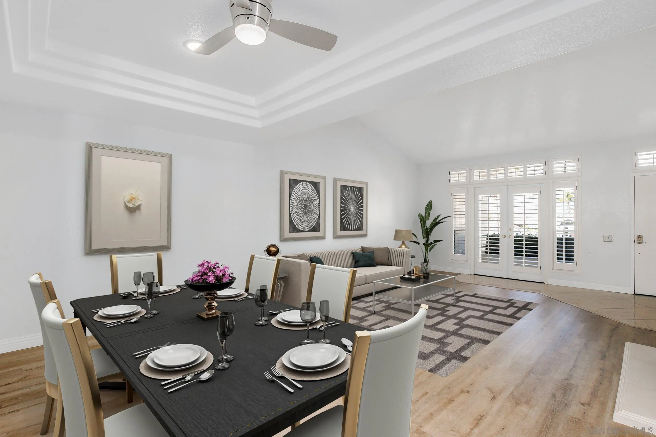 3355 Genoa Way, Unit 134 Oceanside, CA 92056 - Photo 6 of 32 a view of a dining room and livingroom with furniture wooden floor a rug a chandelier