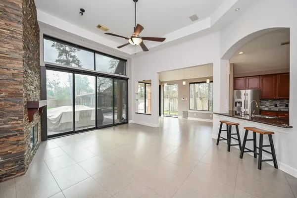 a view of a house with backyard and porch