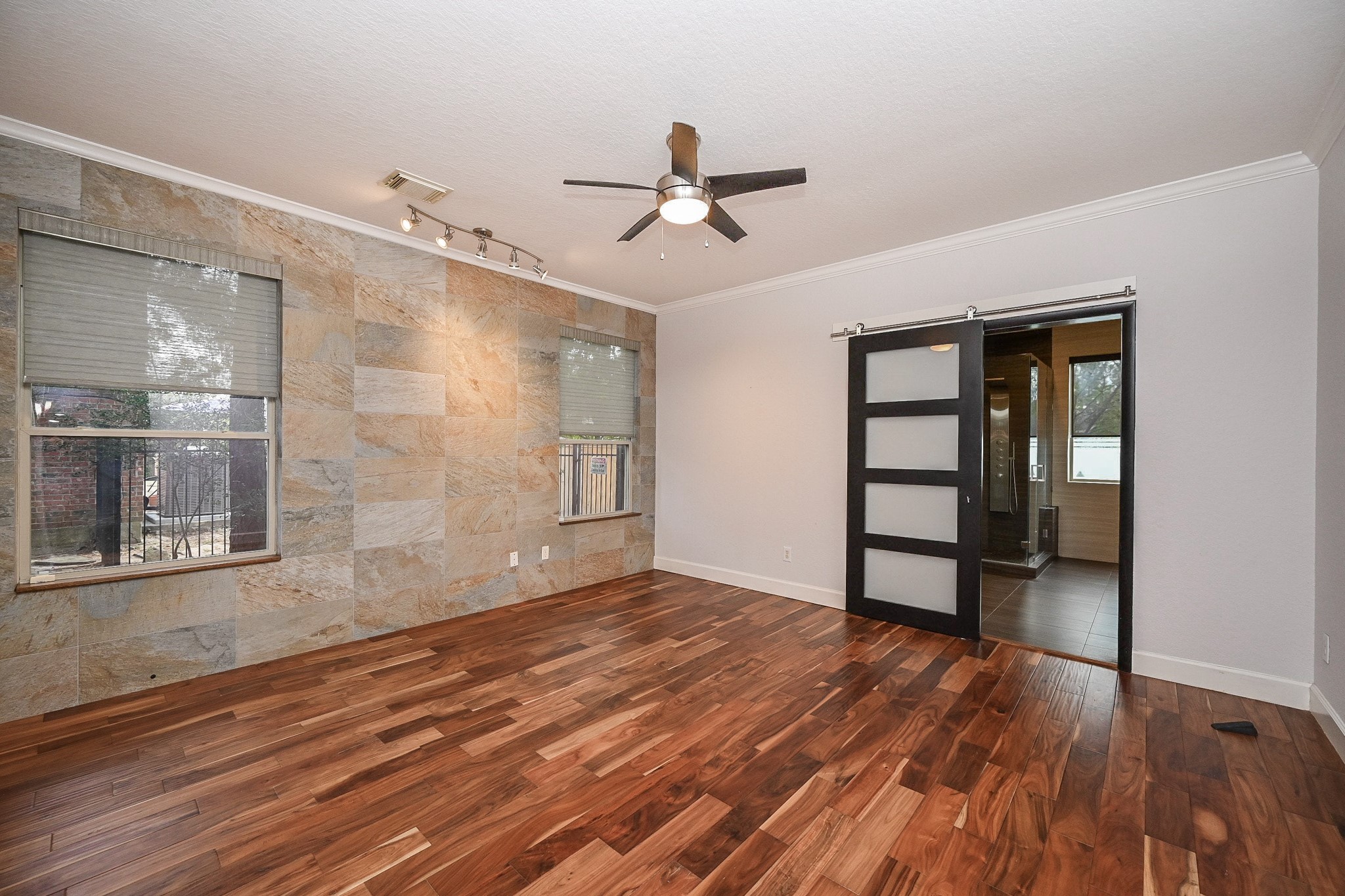 146 Rocky Point Drive Spring, TX 77389 - Photo 19 of 37 a view of empty room with wooden floor and fan