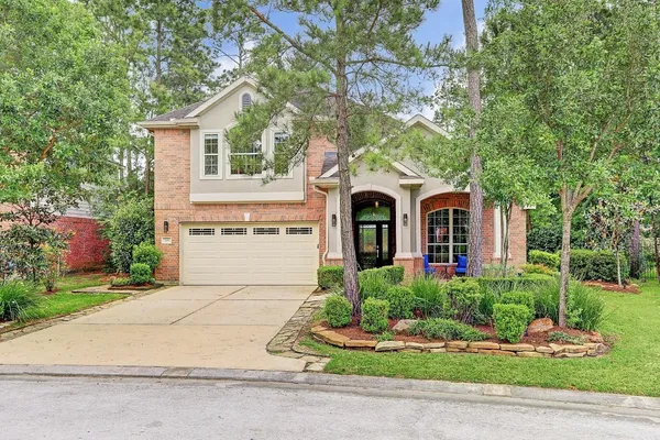 a front view of a house with a large window
