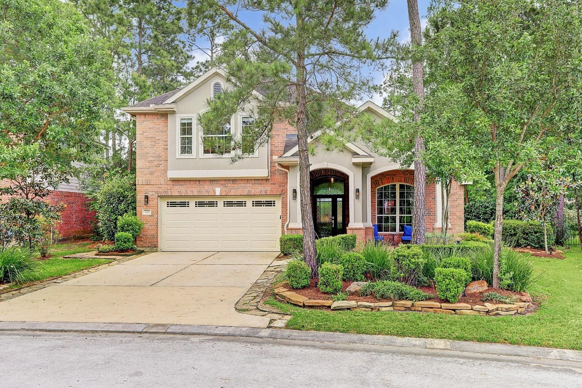 146 Rocky Point Drive Spring, TX 77389 - Photo 2 of 37 a front view of a house with a yard and garage