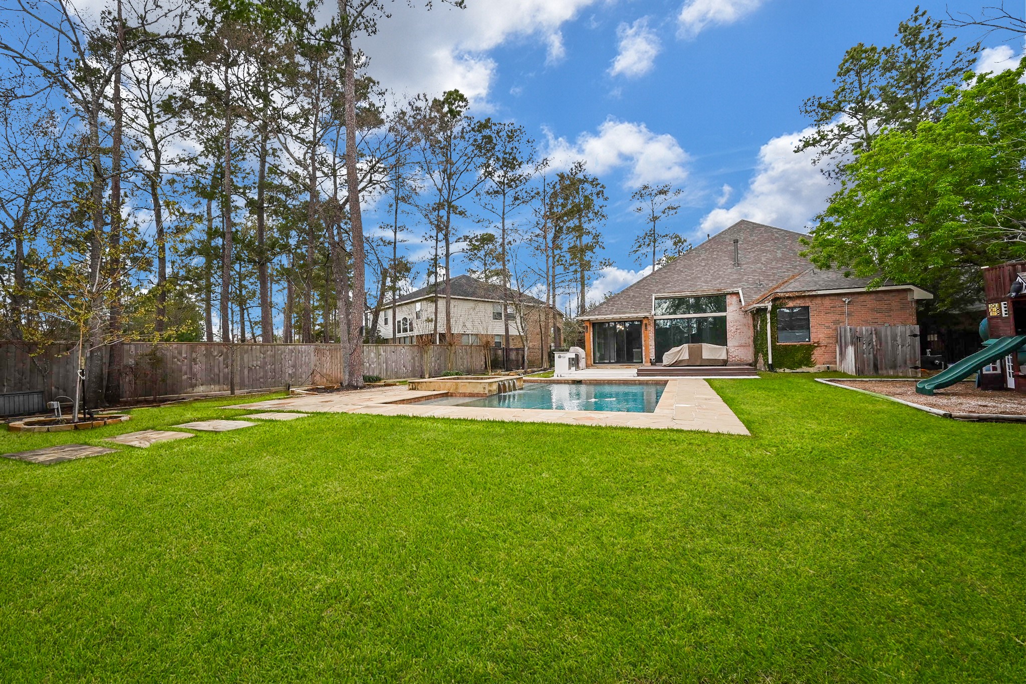 146 Rocky Point Drive Spring, TX 77389 - Photo 31 of 37 a front view of a house with swimming pool having outdoor seating