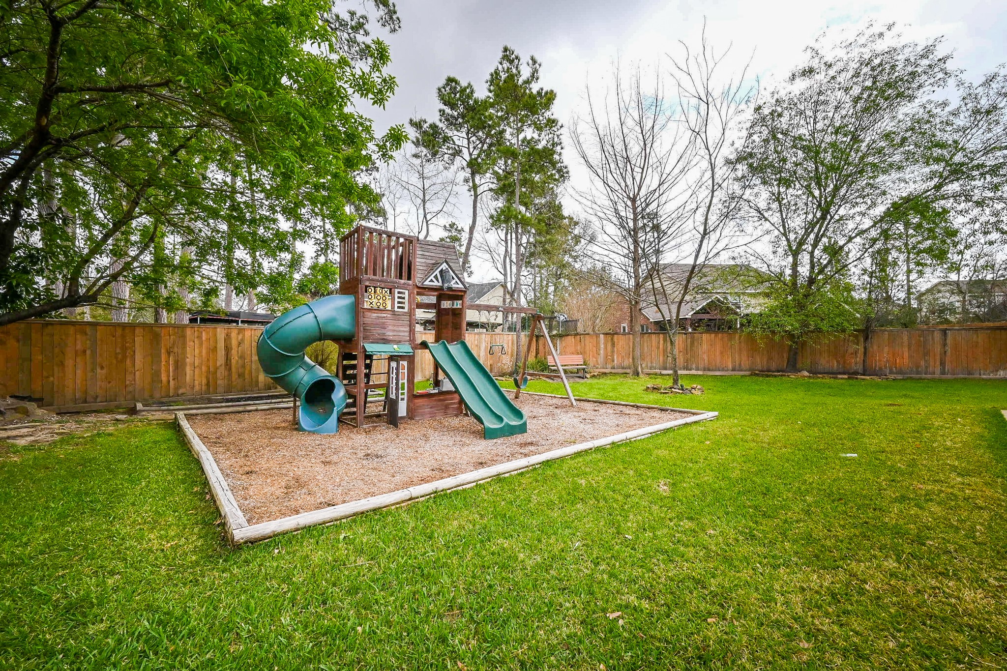 146 Rocky Point Drive Spring, TX 77389 - Photo 36 of 37 a view of a garden with a slide