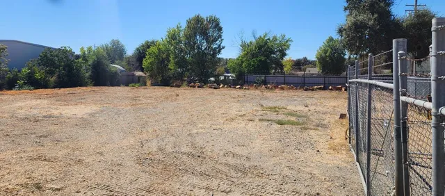 a view of a backyard of the house