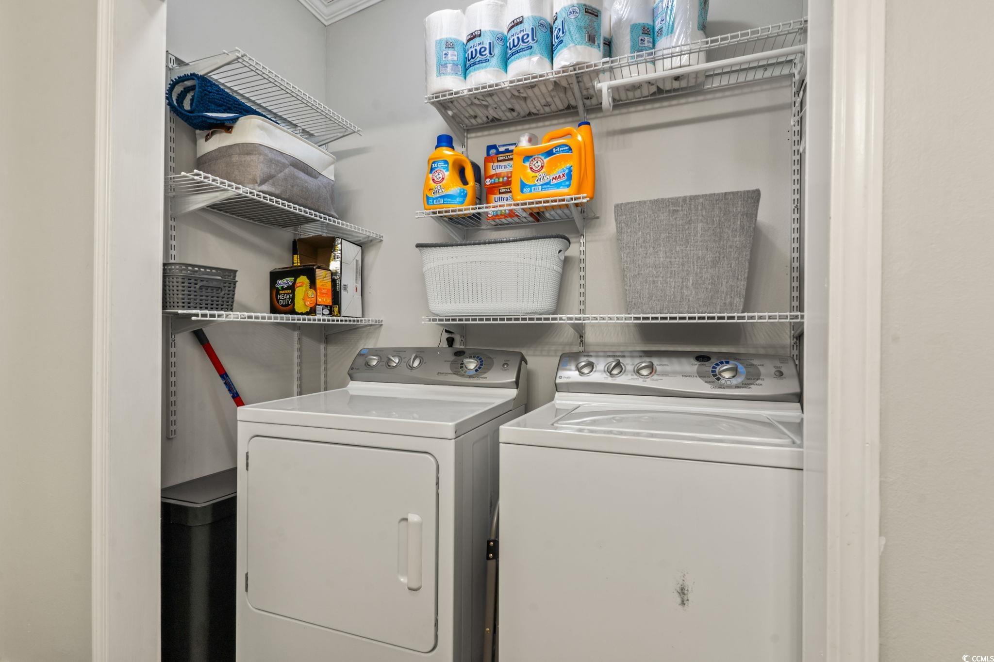 2977 Silverleaf Circle Loris, SC 29569 - Photo 18 of 36 Laundry area featuring washing machine and clothes dryer and crown molding