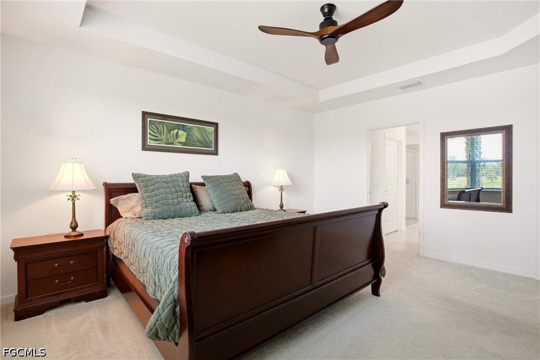 3751 Pebblebrook Ridge Court, Unit 101 Fort Myers, FL 33905 - Photo 21 of 48 a spacious bedroom with a bed and a window