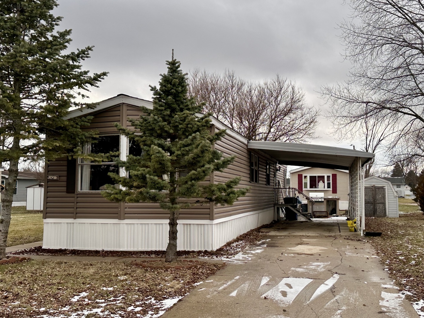 1021 Springdale Lane DeKalb, IL 60115 - Photo 1 of 12 a front view of a house with a yard