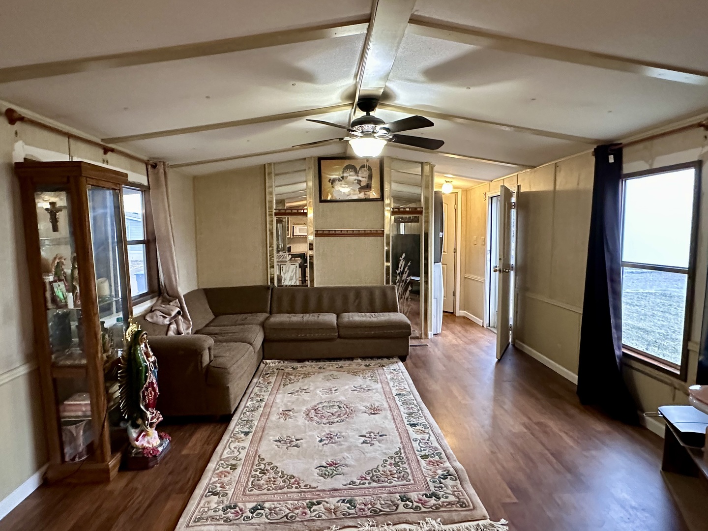 1021 Springdale Lane DeKalb, IL 60115 - Photo 3 of 12 a living room with furniture and a chandelier