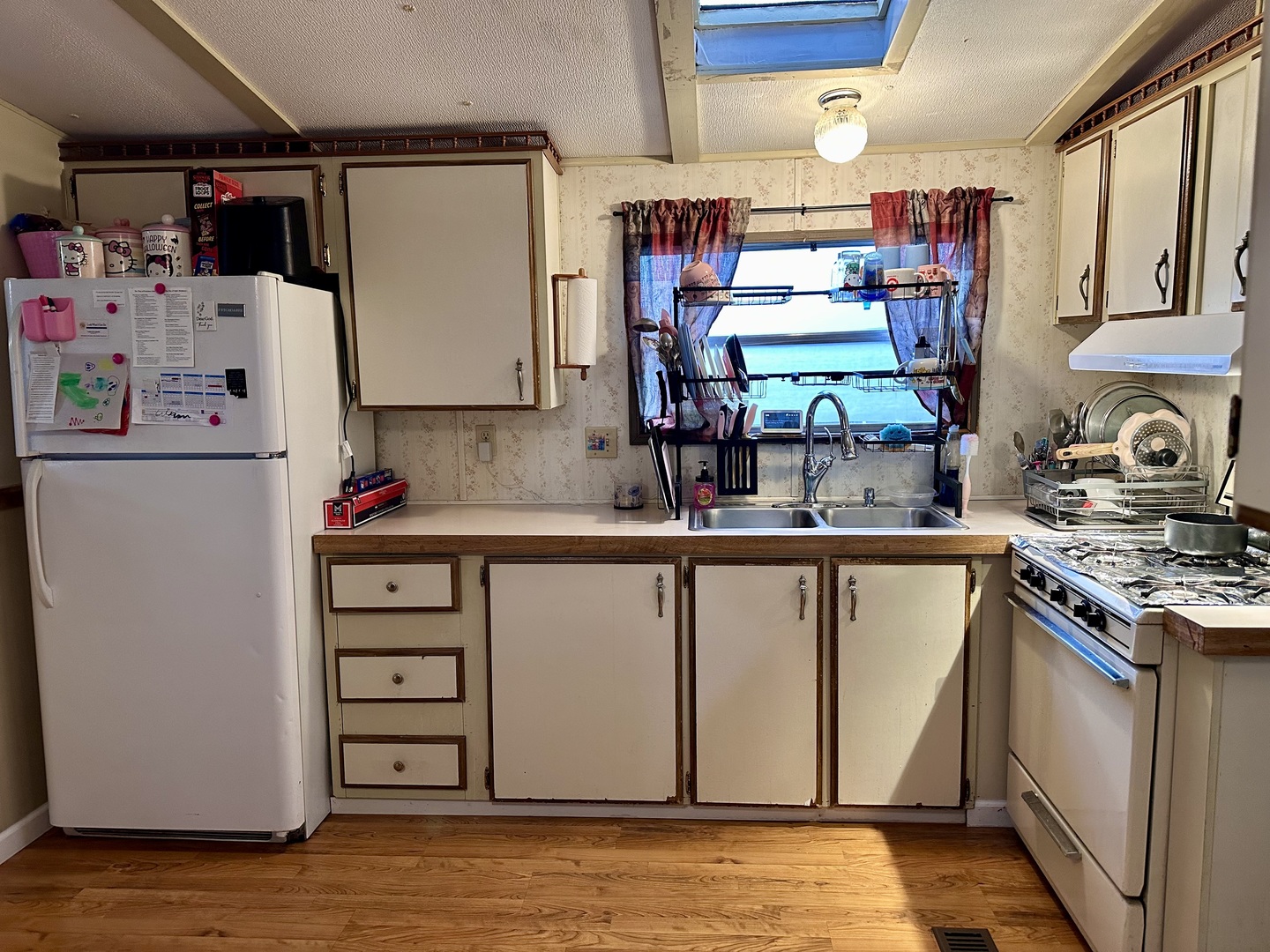 1021 Springdale Lane DeKalb, IL 60115 - Photo 5 of 12 a kitchen with refrigerator and window