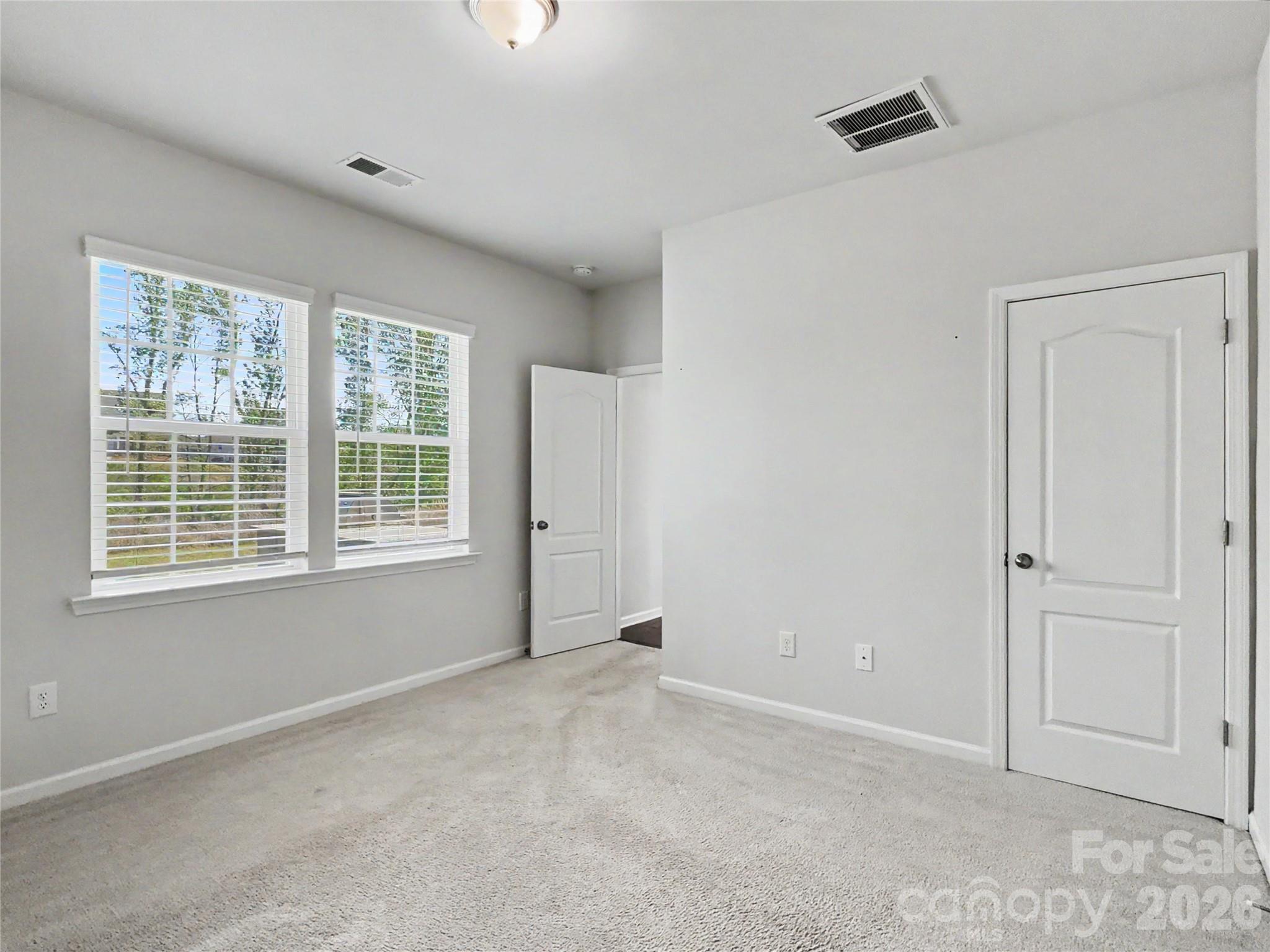 16835 Cozy Cove Road Charlotte, NC 28278 - Photo 13 of 32 a view of an empty room with a window