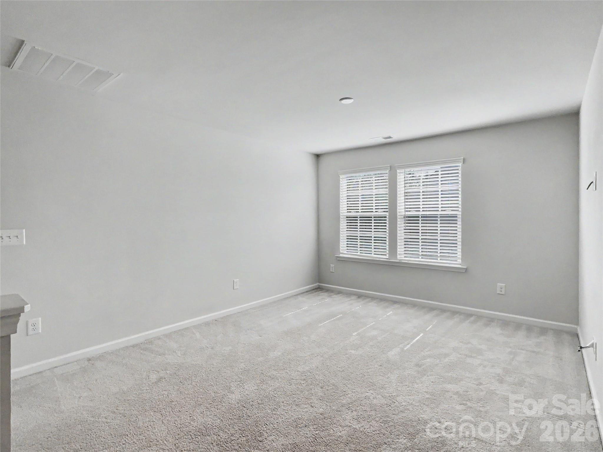 16835 Cozy Cove Road Charlotte, NC 28278 - Photo 15 of 32 an empty room with windows
