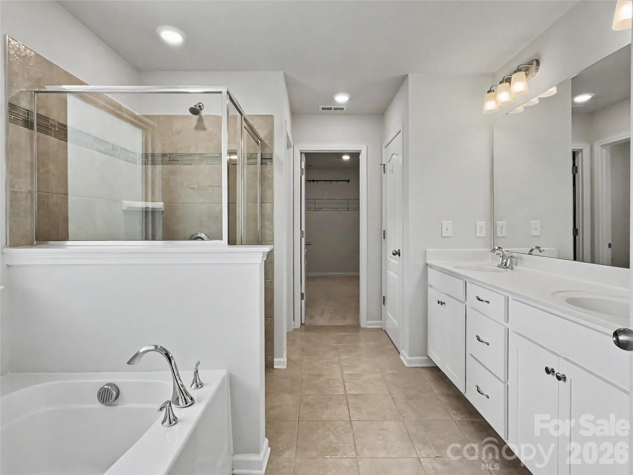 16835 Cozy Cove Road Charlotte, NC 28278 - Photo 17 of 32 a bathroom with a double vanity sink mirror and shower
