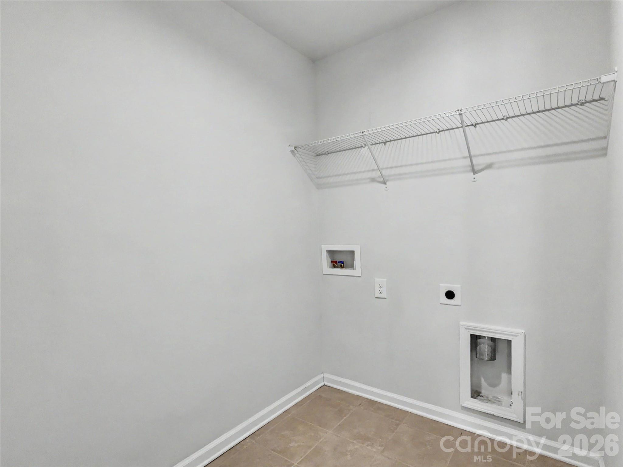 16835 Cozy Cove Road Charlotte, NC 28278 - Photo 22 of 32 a view of a room with racks on the wall