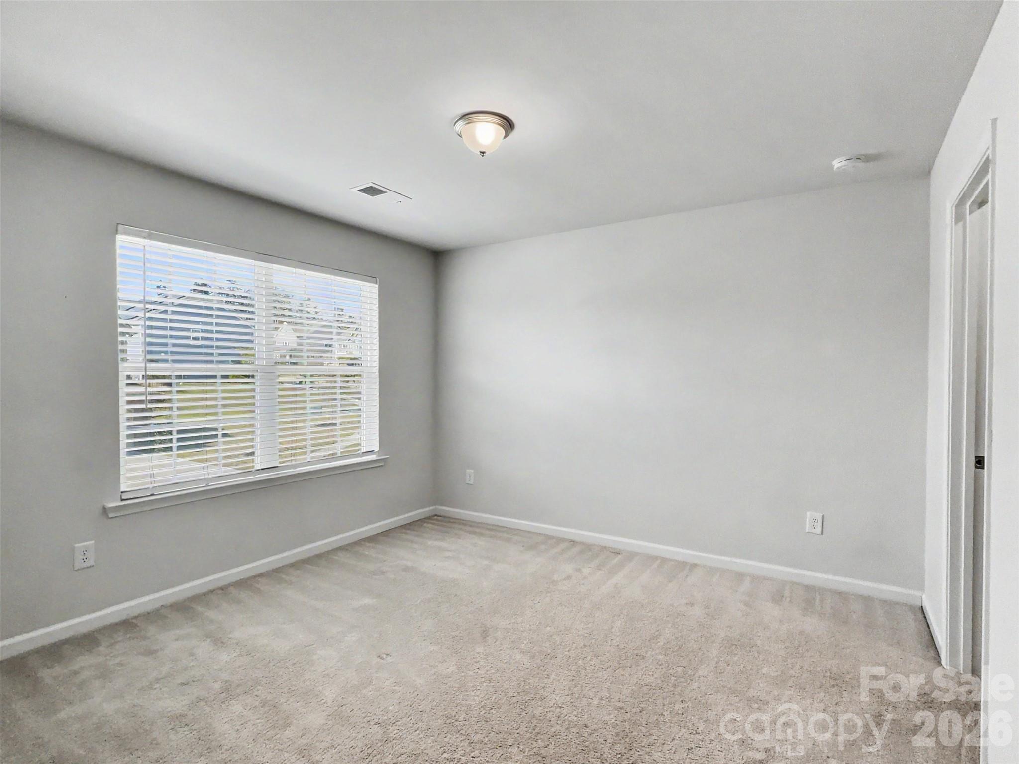 16835 Cozy Cove Road Charlotte, NC 28278 - Photo 23 of 32 a view of an empty room with a window