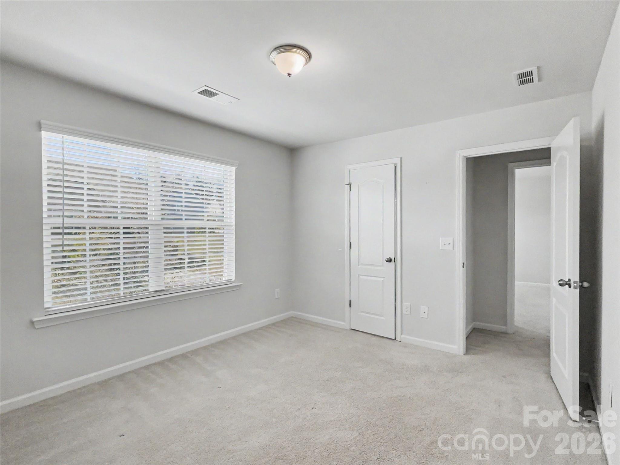 16835 Cozy Cove Road Charlotte, NC 28278 - Photo 25 of 32 a view of an empty room with a window